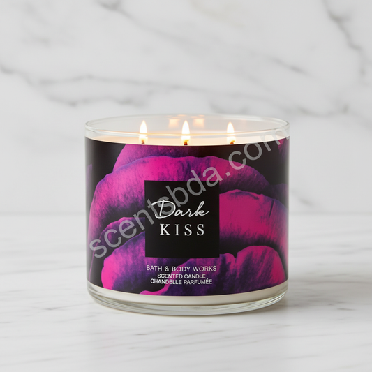 Dark Kiss candle minimalist shot on white marble with lit flame and scentsbda.com watermark