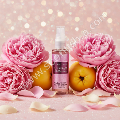A Thousand Wishes 1 fl oz Hand Sanitizer with pink peonies and golden bokeh background