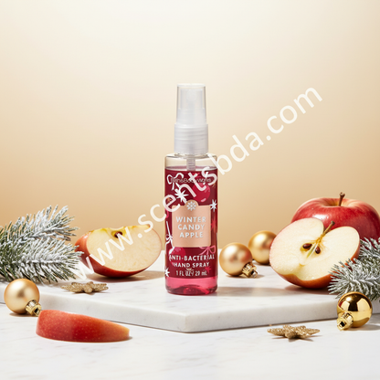Winter Candy Apple 1 fl oz Hand Sanitizer on white marble with red apples, pine, and gold ornaments